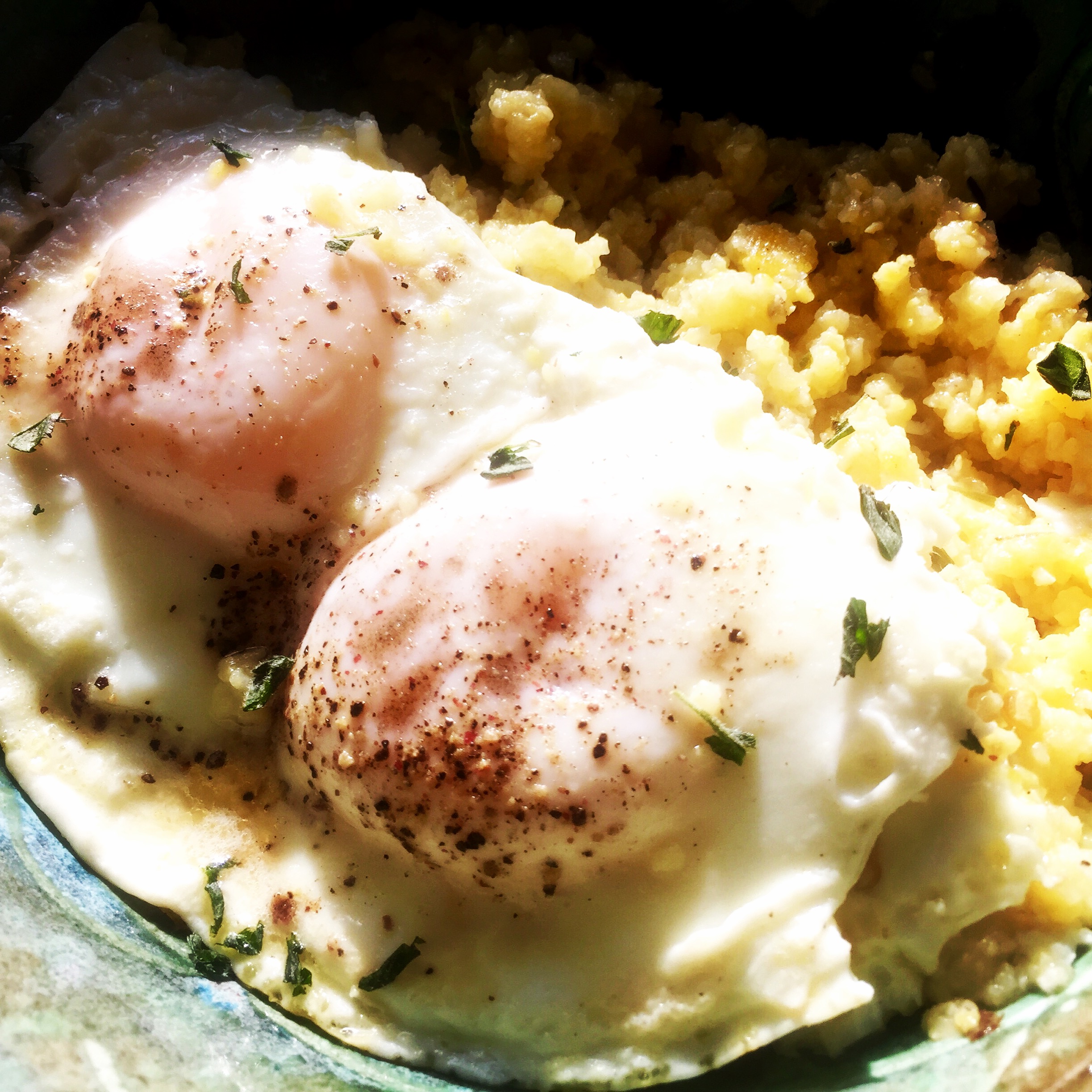 Sunny-side up local eggs with smoked sea salt and polenta