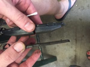 New brake pads and a cautionary brake image.